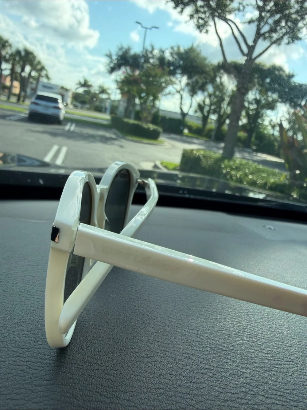 Saint Laurent Women’s Cream Round Sunglasses with Black Lenses